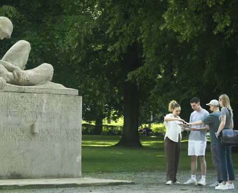 Team at the monument in the park