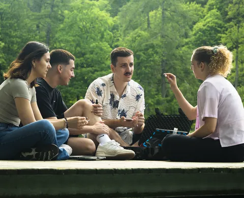 Team discusses a clue on the jetty