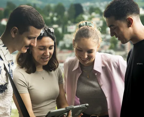 Team studies the tablet above the city