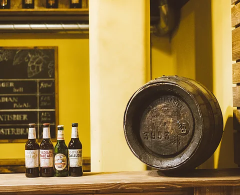 Beer bottles and barrel in the brewery