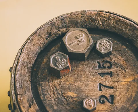 Wooden barrel with numbers and symbols