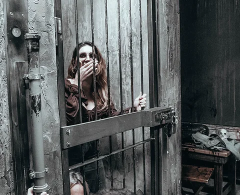 Player behind the barred cell door
